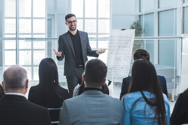 Speaker is pointing at a flip chart during your business
presentation. business and education