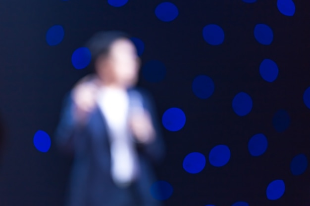 Speaker on stage in a conference room