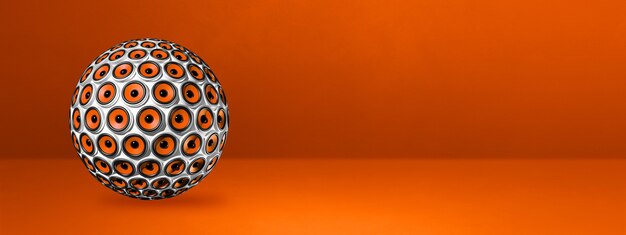 Speakers sphere isolated on a orange studio banner.