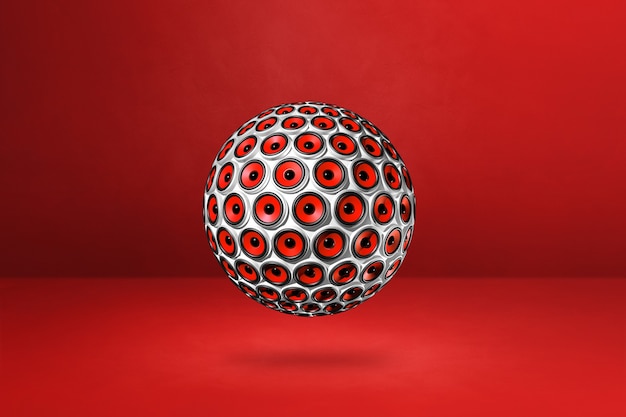 Speakers sphere isolated on a red studio