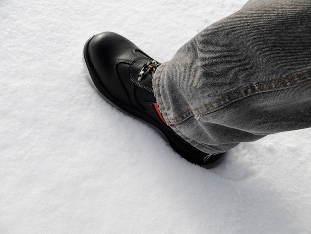 Special boots in the snow Closeup on a background of snow