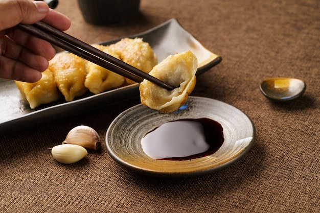 Special Chinese food raw fried dumplings on a monochrome background