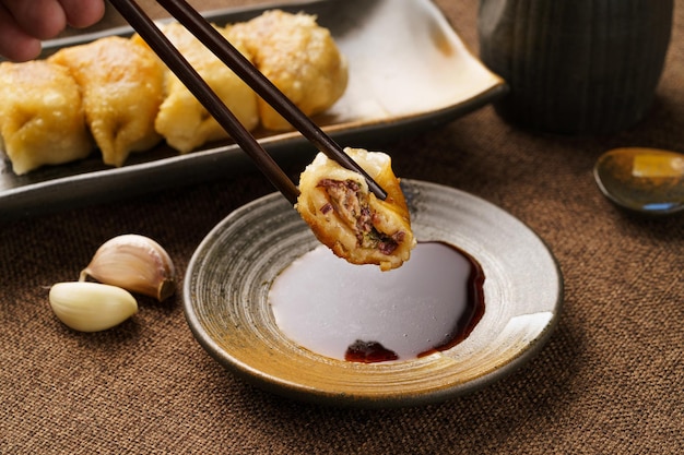 Special Chinese food raw fried dumplings on a monochrome background