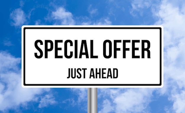 Special Offer just ahead road sign on blue sky background