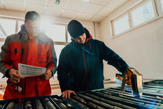 A special team of geologists studying rocks in the industry using modern machines.Selective focus. High-quality photo