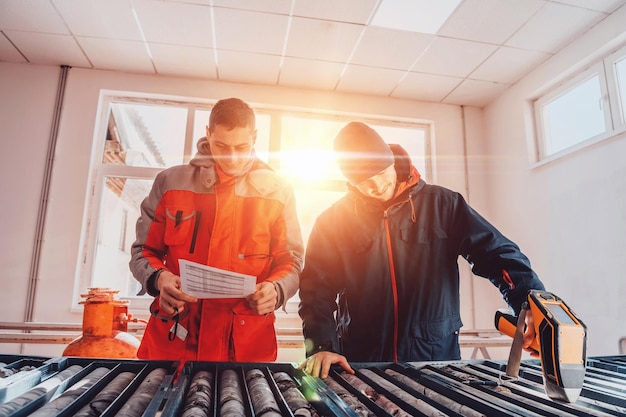 A special team of geologists studying rocks in the industry using modern machines.Selective focus. High-quality photo