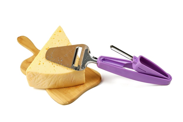 Special tool for cutting cheese slices on triangular piece of cheese on white background