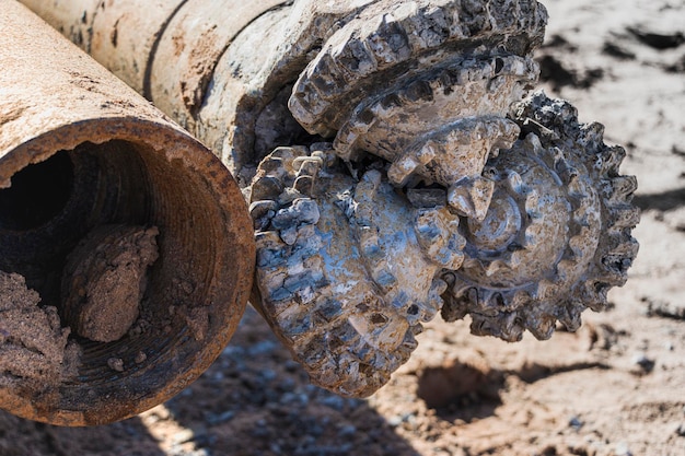 Special tool for drilling rig work on construction site. Close-up. Drilling and mineral exploration tool.