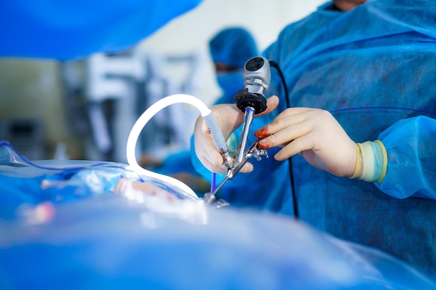 Special tube for operation Neurosurgery equipment in hands of experienced doctor Selective focus Cropped photo