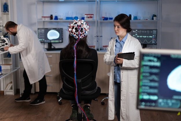 Specialist researcher doctor monitoring brain activity evolution