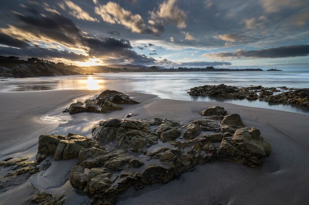 spectacular reflections of the sunset on the beach of Arnao