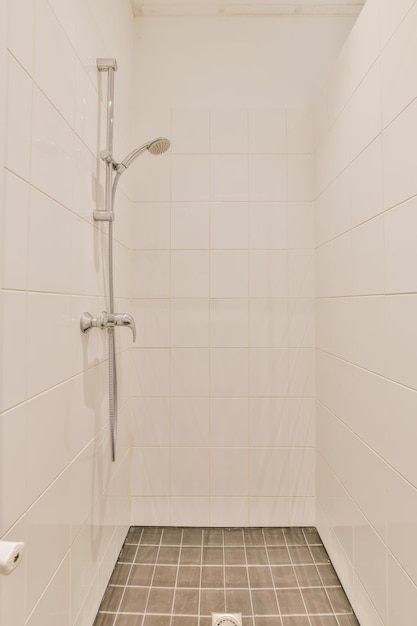 Spectacular shower design with brown tiled floor