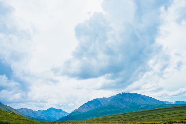 Spectacular view of giant mountains under cloudy sky