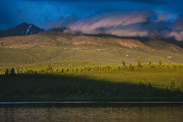 Spectacular view of the mountain range at the lake at sunset in Ulagansky district of the Altai Republic, Russia