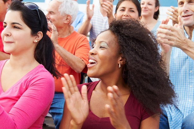 Photo spectators cheering at outdoor sports event