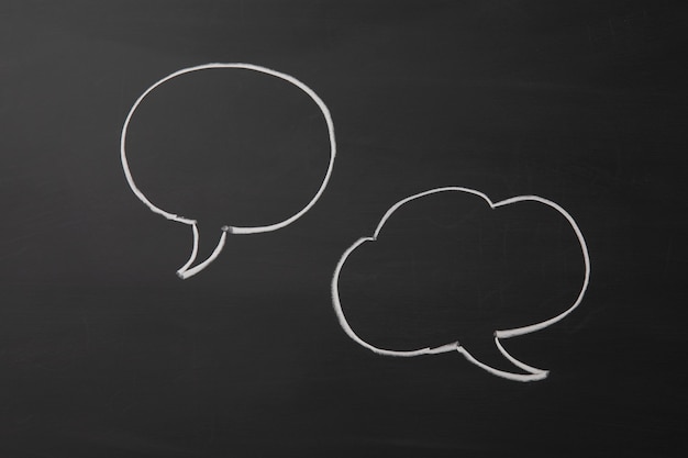 speech bubble on black chalkboard background