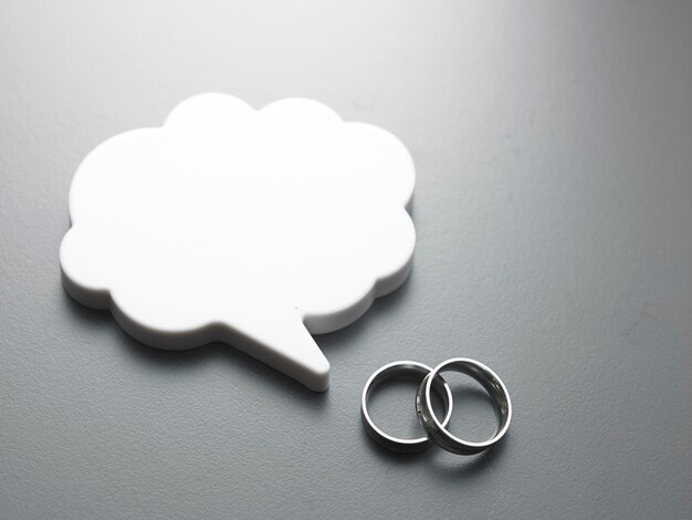 Photo speech bubble and ring against gray background