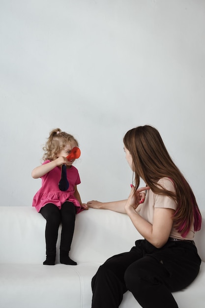 Speech therapist and girl in the office