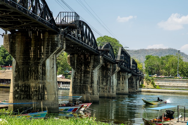 Speed boat under the Death Railway bridge