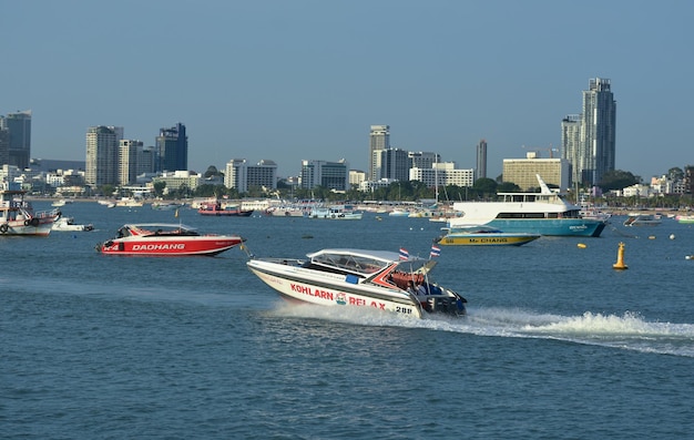 Speed boats and passenger boats parked in the sea for transporting tourists at Pattaya PierxA Captured on July 6 2023 in Pattaya Thailand