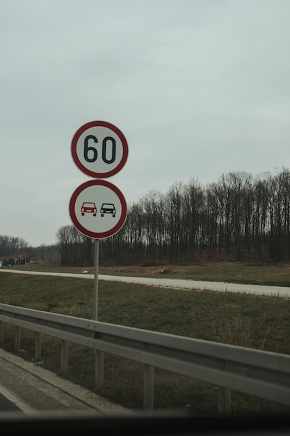 Speed limit sign "60 km per hour" on the highway