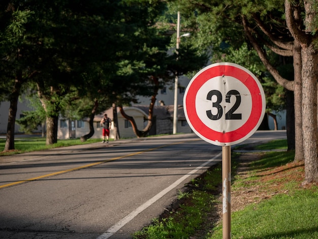 Photo speed limit sign by road