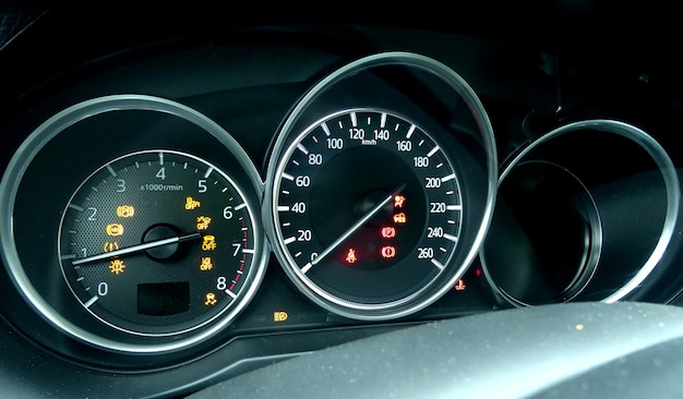 Speedometer and display of active collision avoidance system on car dashboard