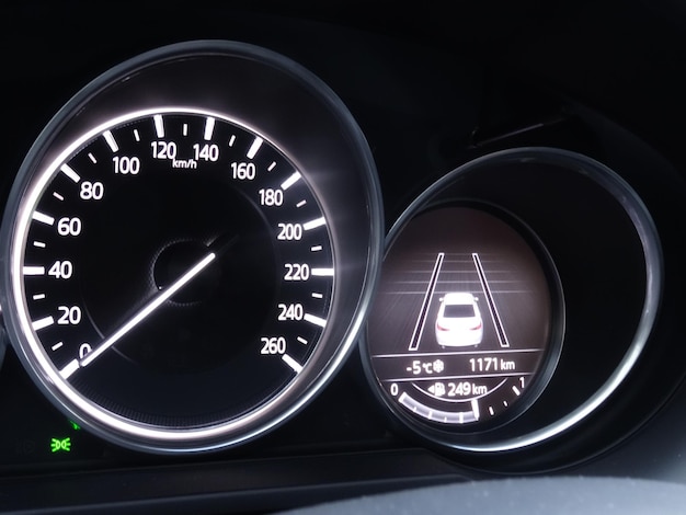 Speedometer and display of active collision prevention assist on car dashboard