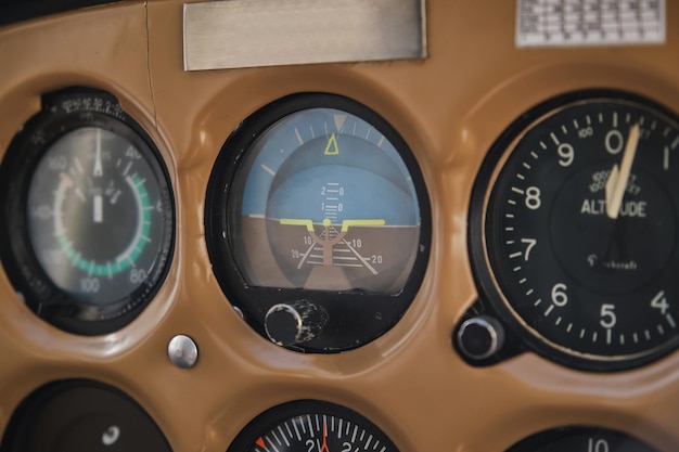 Speedometers and indicators of dashboard in single engine civil utility aircraft in daylight