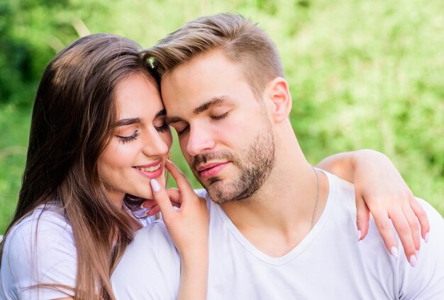 Spending nice time. couple in love. Skin and hair care. girl with guy in park. Beauty and fashion. valentines day. summer vibes. family weekend. romantic date. couple relax outdoor. Tender feeling.