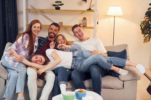 Spending weekend together Group of friends have party indoors together