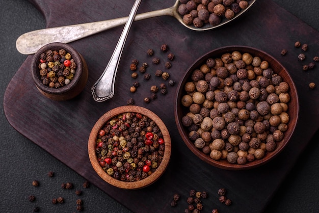 Spice allspice brown color not ground in a wooden saucer Asian food