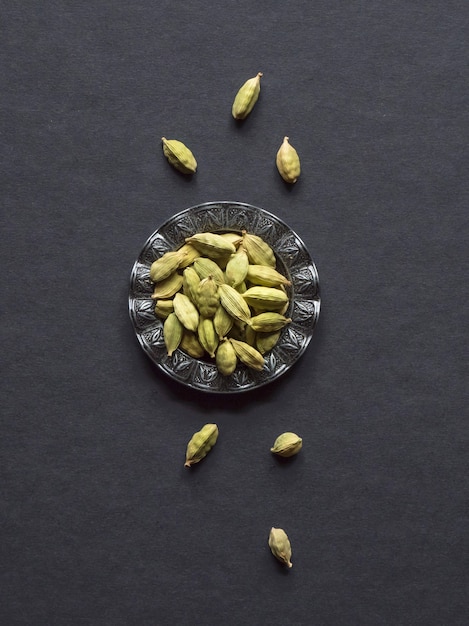 The spice cardamom in a black table.