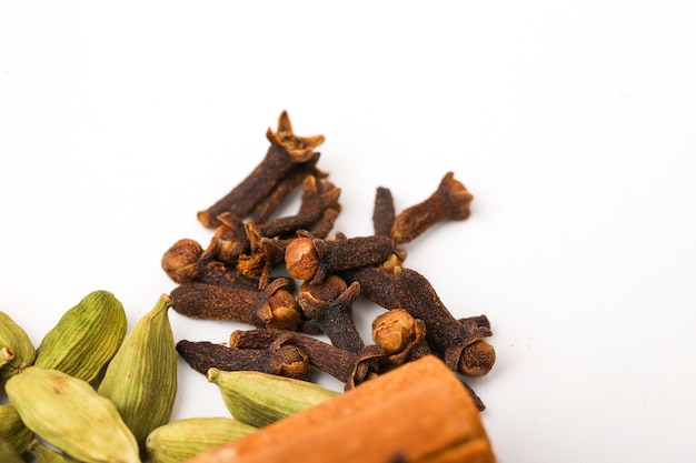 Spice cloves on white surface.