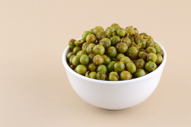 Spiced fried green peas {chatpata matar} Indian snack. Dried salted green peas