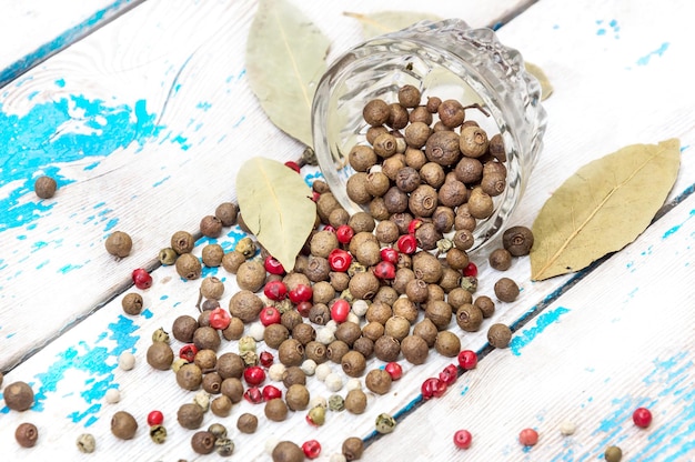 Spices are scattered on an old table