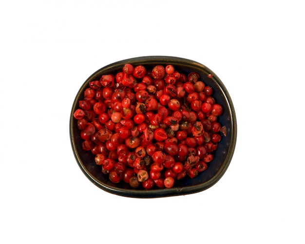  spices in a clay dark bowl on a white background