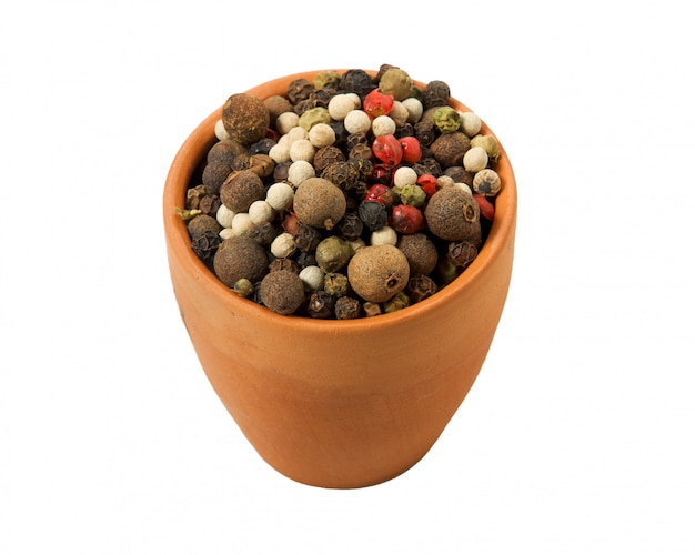  spices in a clay dark bowl on a white background