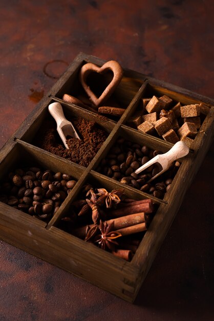 Spices, coffee and cookies in wooden box