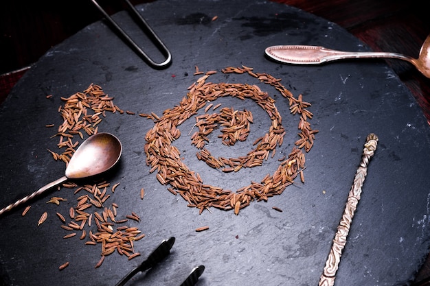 Spices cumin on black background. close up