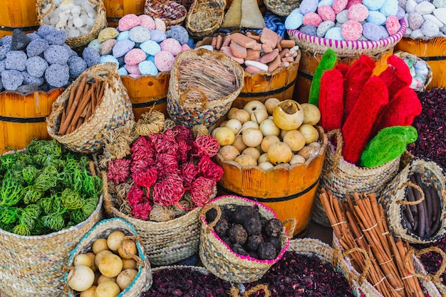 Spices and herbs in baskets at market