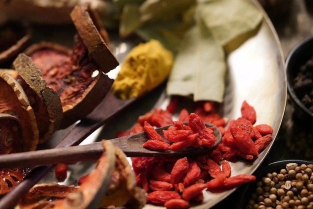 Photo spices and herbs on old kitchen table.