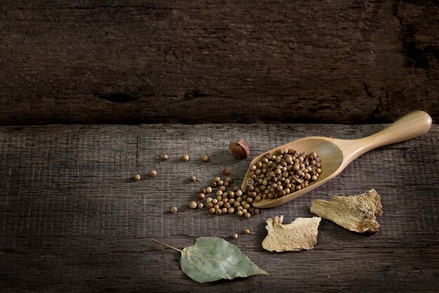 Spices and herbs on old kitchen table