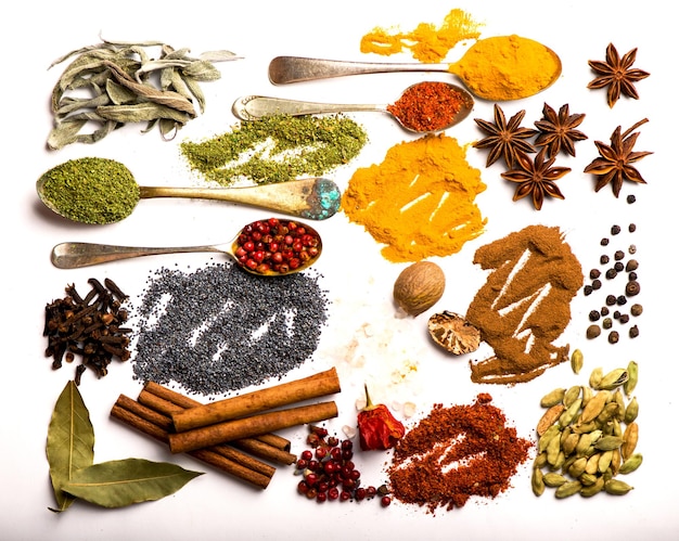 Spices and herbs on white background top view