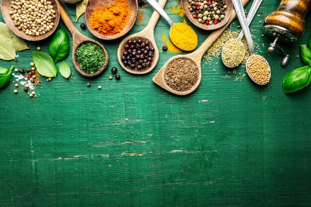 Spices and herbs on wooden background