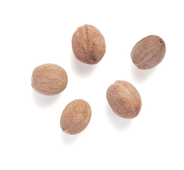 Spices nutmeg isolated on white background