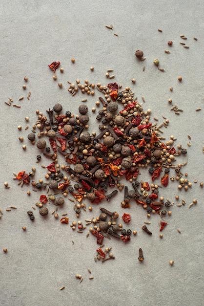 Spices scattered on a gray background top view