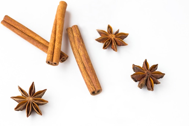 Spices star anise and cinnamon sticks on white background Close up