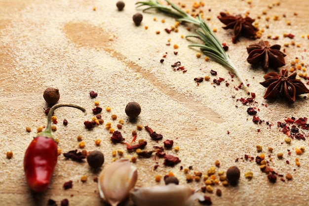 Photo spices on table with spoon silhouette closeup