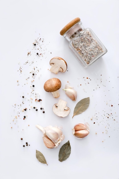 Spices and vegetables on light grey background top view